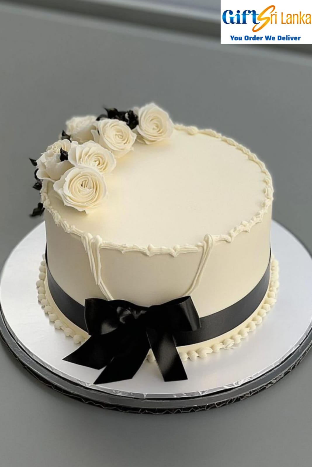 1kg ribbon cake with buttericing covered. Decorated Sugar Flowers