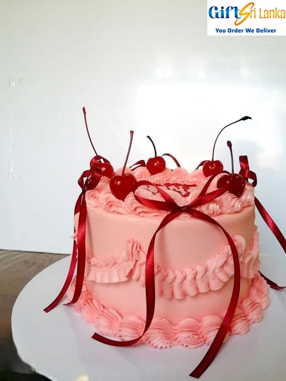 Elegant 1kg Pink Ribbon Cake with Ruffle Design and Cherry Topping