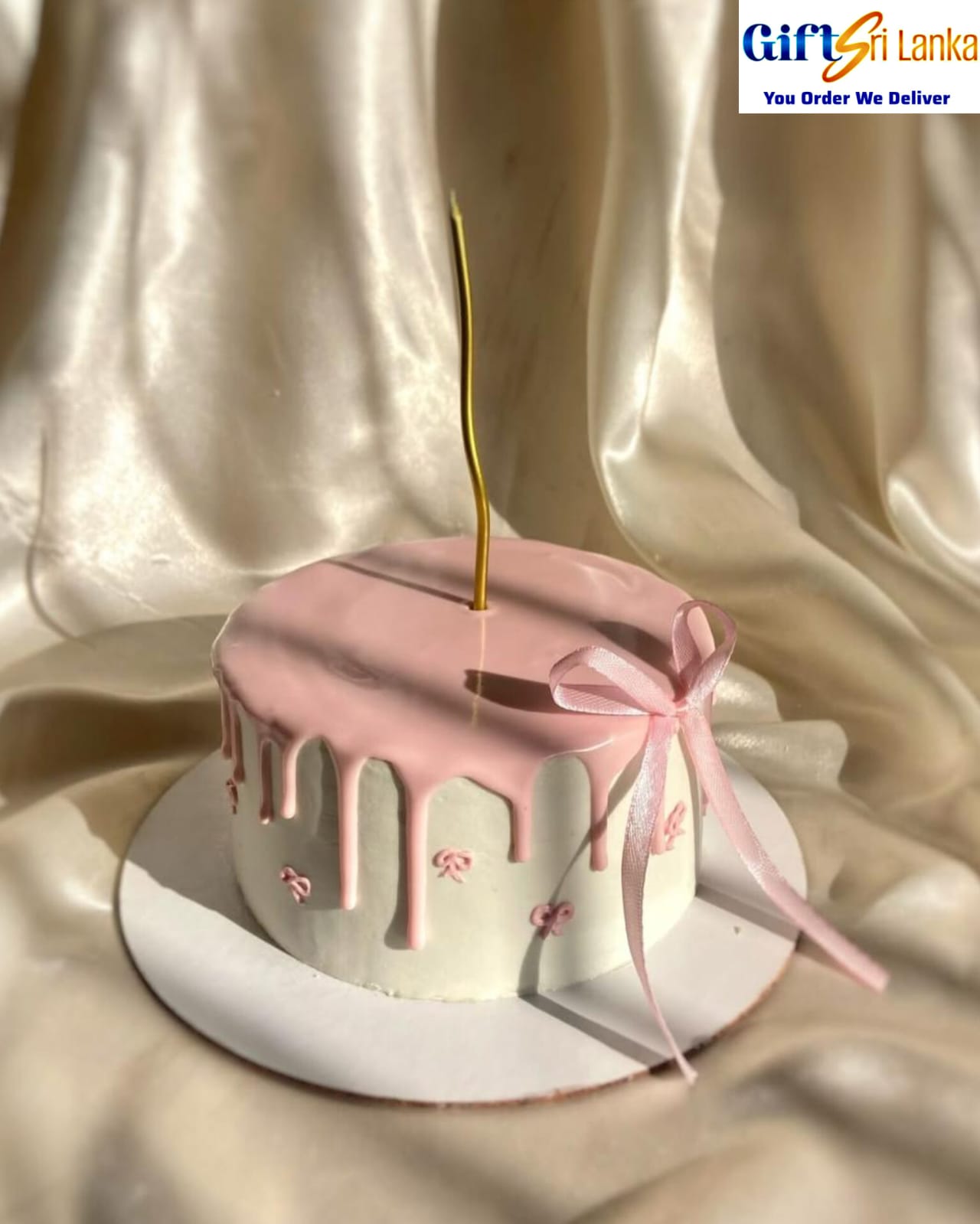 Elegant Pink Drip Ribbon Cake with Gold Candle – 1kg Vanilla